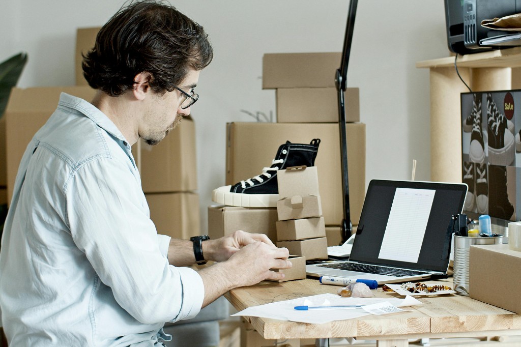 E-commerce business owner reviewing automated customer engagement system