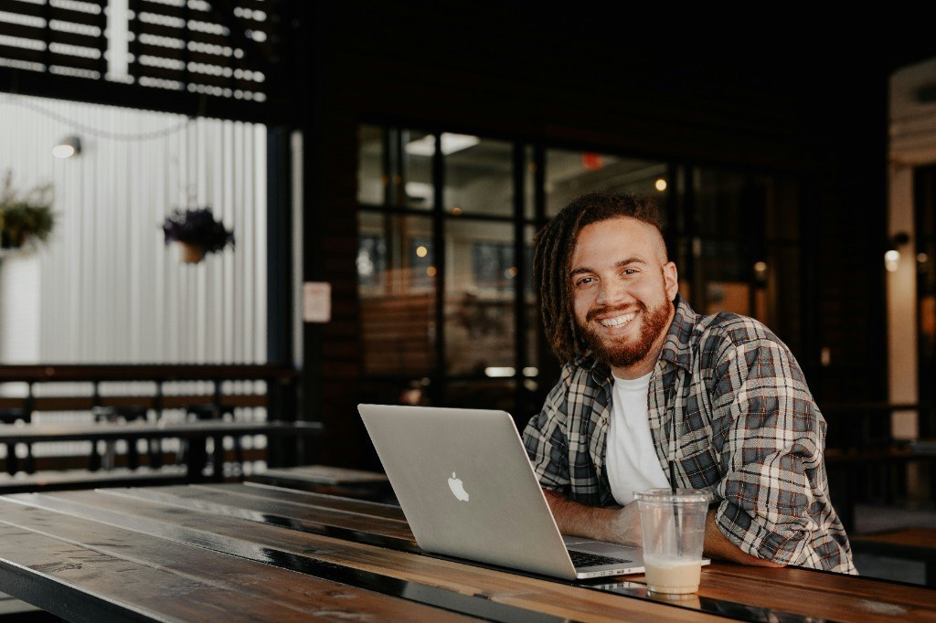 Fitness studio owner reviewing automated member engagement system