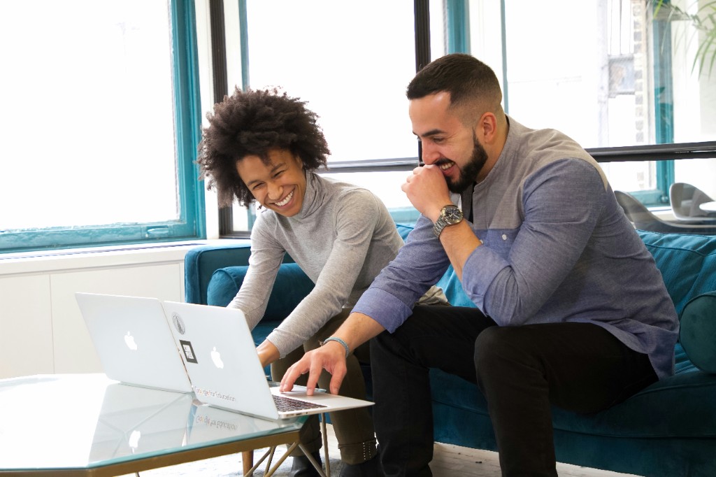 Two business owners reviewing their automation results together