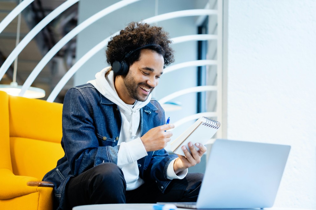 Person learning online with headphones